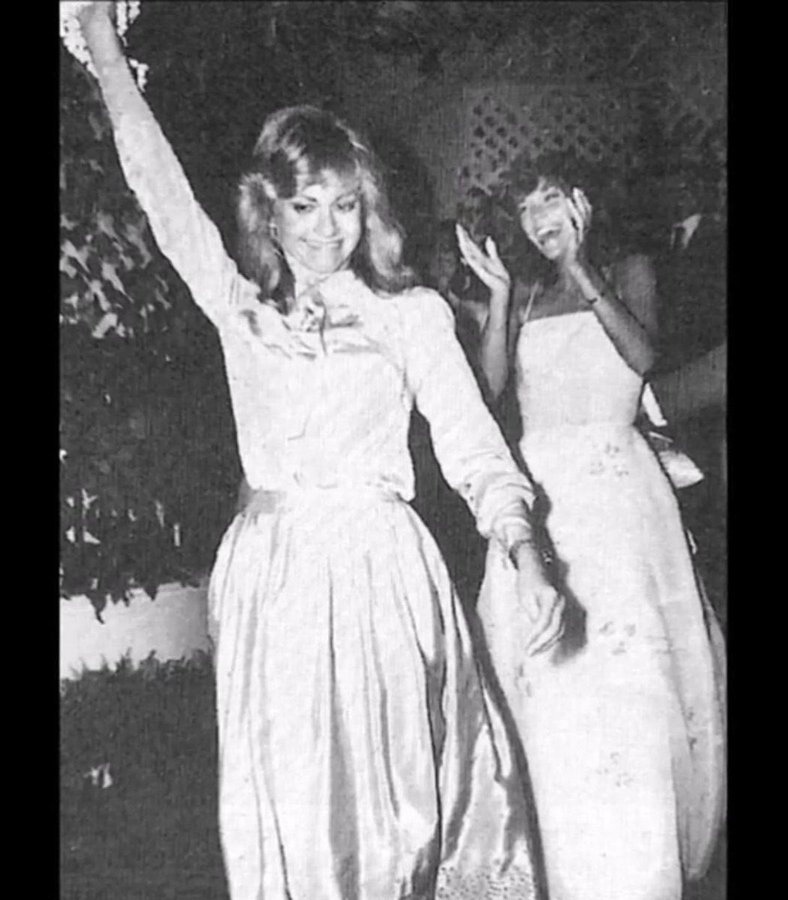 Olivia Newton-John catching bouquet at Karen's wedding