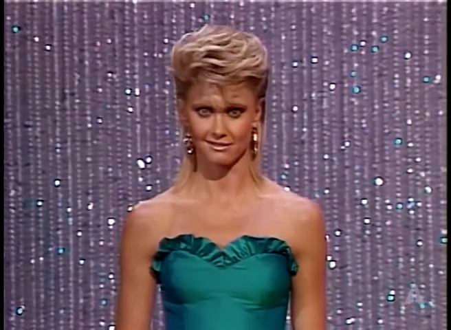 Olivia Newton-John presenting Oscar 1983